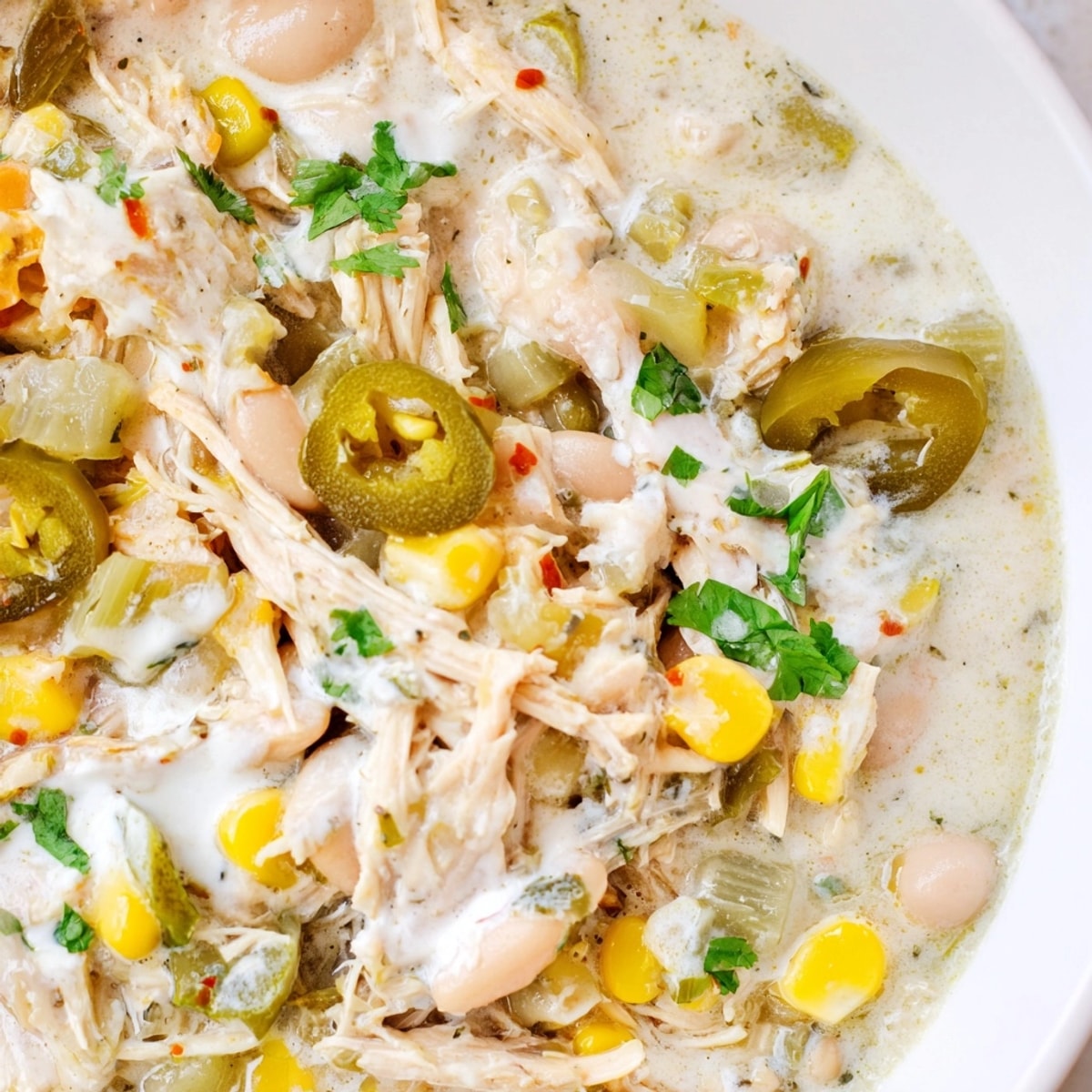 Creamy, tangy One-Pot Pickle-Fix White Chicken Chili simmering, ready to be served hot.