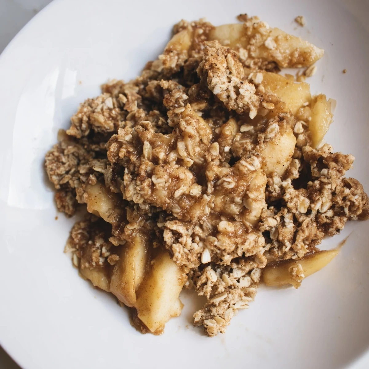 Warm Apple Crisp with golden, bubbly edges, perfect for a cozy dessert night.