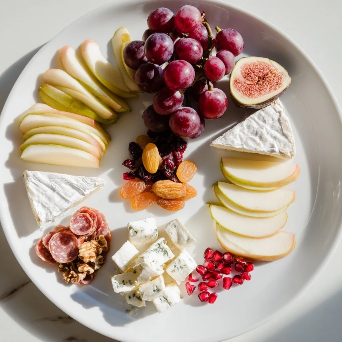 A stunning Moments Magiques Plateau Bonne Année 2026 recipe, showcasing colorful fruits, cheeses, and charcuterie for New Year's.