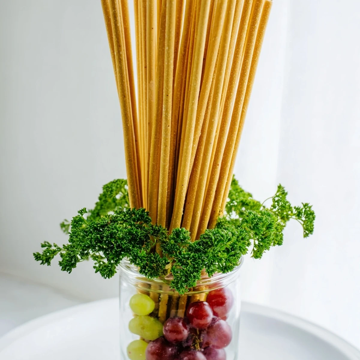 A beautiful view: The Vertical Forest features breadsticks arranged with parsley and bursts of colorful grapes ready to eat.