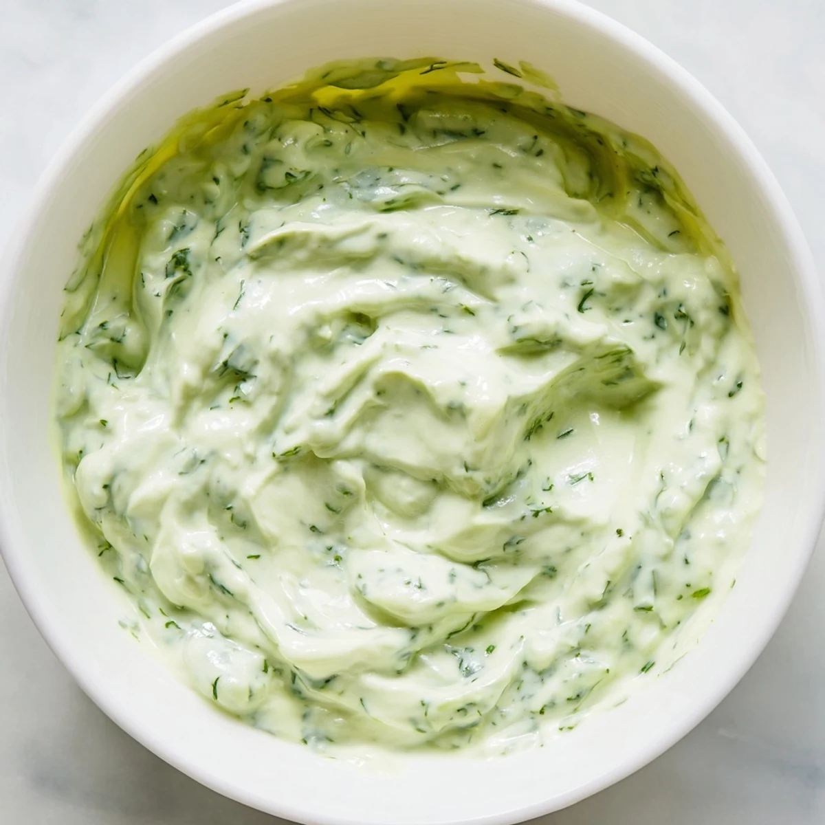 Creamy Green Goddess Dip, vibrant green and bursting with fresh herb flavors, ready to serve.