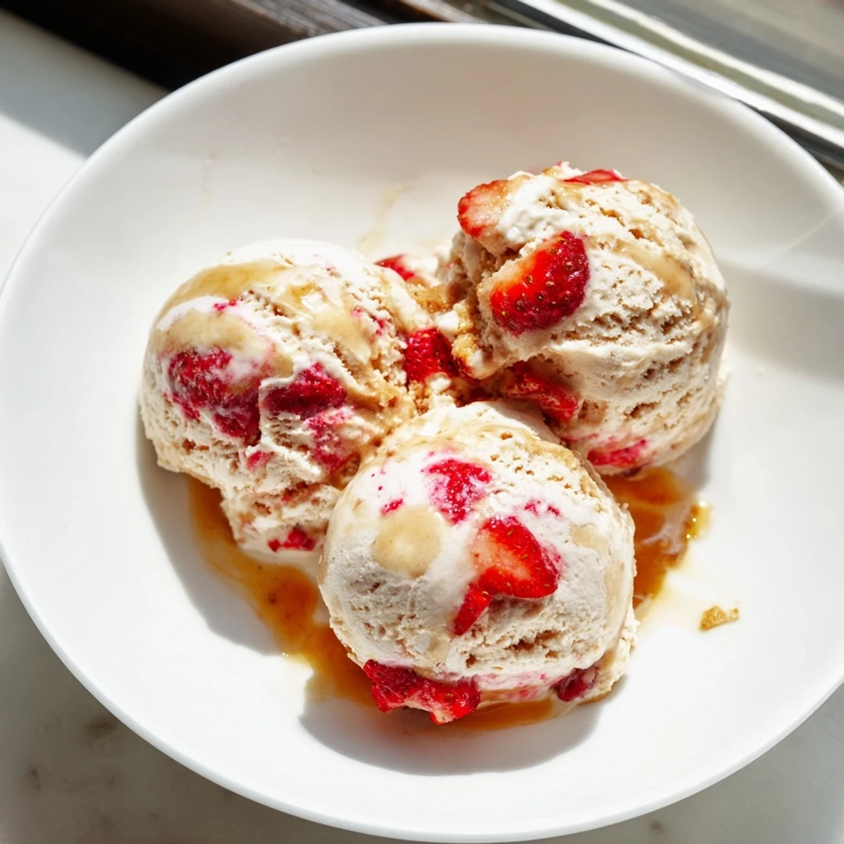 Freshly churned cottage cheese ice cream, served in a glass, perfect for a summer treat.