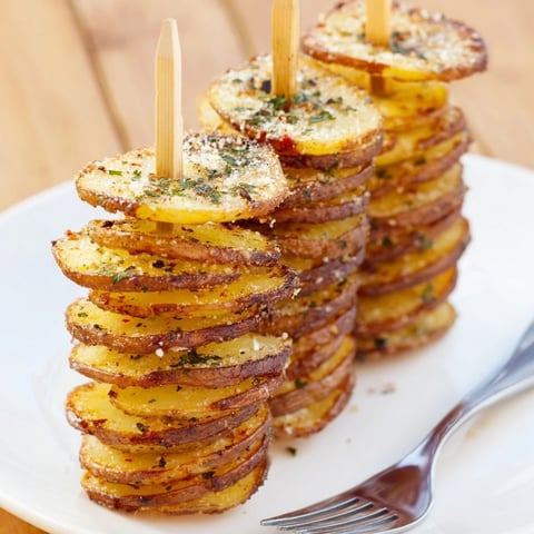 Crispy air-fryer tornado potatoes drizzled with olive oil, garlic, and spices.  