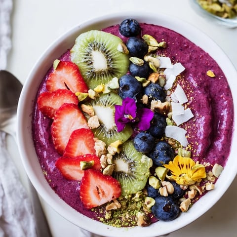 Colorful Vibrant Smoothie Bowls with unexpected twists, topped with fresh fruits and granola.  