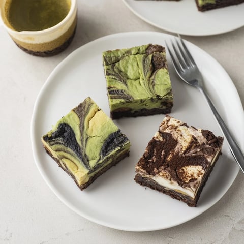 Delicious matcha-miso brownies topped with a lush chocolate glaze and green tea flavor.  