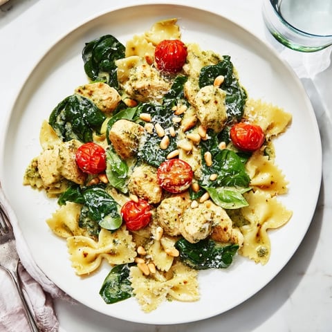 Creamy Pesto Chicken Bowtie Pasta: A vibrant, delicious Italian-American dish with tender chicken.