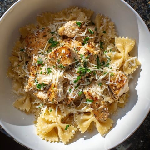 Creamy mozzarella garlic butter chicken bowties: a comforting pasta dish with melted cheese and savory chicken.