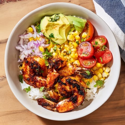 Grilled shrimp bowl with avocado corn salsa: a flavorful summer meal, featuring perfectly grilled shrimp.