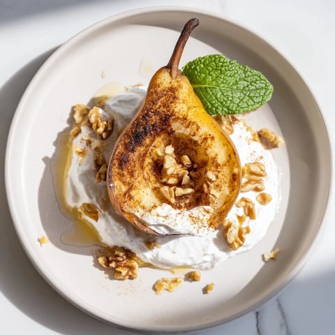 Golden caramelized roasted pears with cinnamon, walnuts, and Greek yogurt make a delicious dessert.