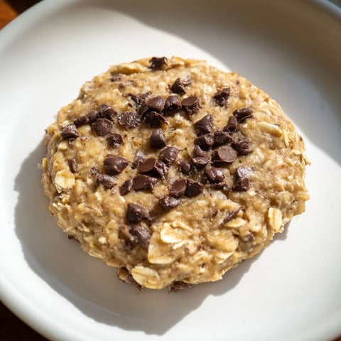 Oat-Banana Chocolate Chip Cookies, golden brown and chewy, perfect with a glass of milk.