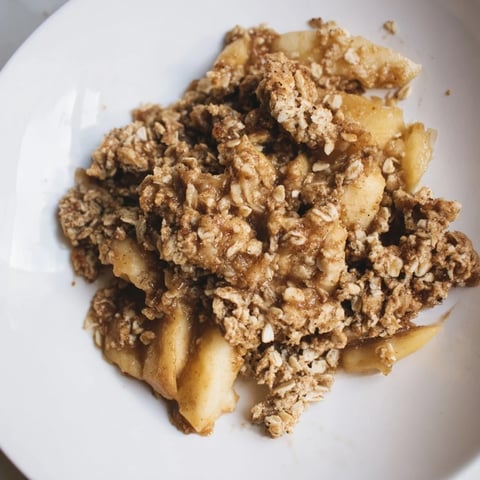 Warm Apple Crisp with golden, bubbly edges, perfect for a cozy dessert night.