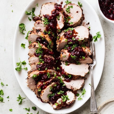 Seared Tart Cherry Date Glazed Pork Tenderloin with glistening glaze, ready to serve and enjoy.