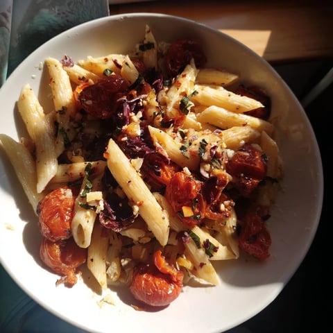 Baked Tomato & Olive Oil Pasta with roasted tomatoes, garlic, finished with fresh basil, ready to serve.