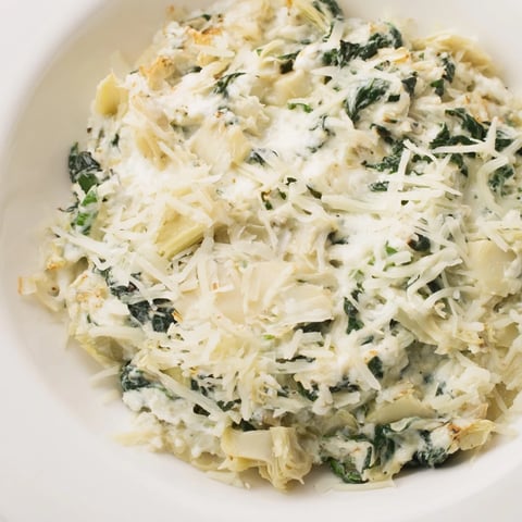 Warm, bubbly spinach artichoke dip, served with crispy tortilla chips for dipping and enjoyment.