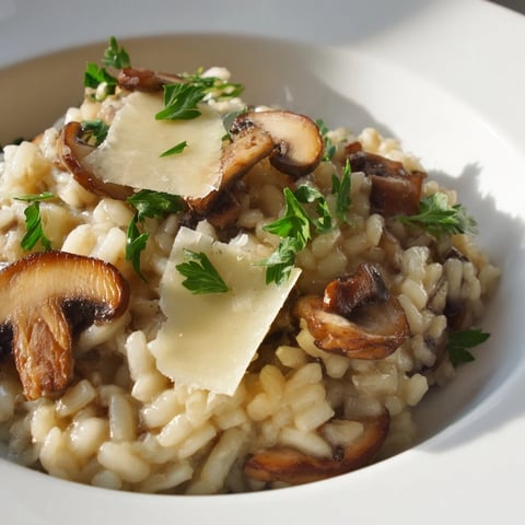 A steaming bowl of creamy Italian Mushroom Risotto, garnished with fresh parsley and Parmesan.