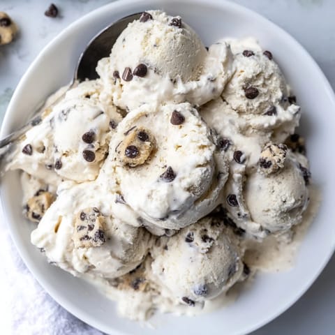 Guilt-free Cottage Cheese Ice Cream topped with rich chocolate chip cookie dough bites.  