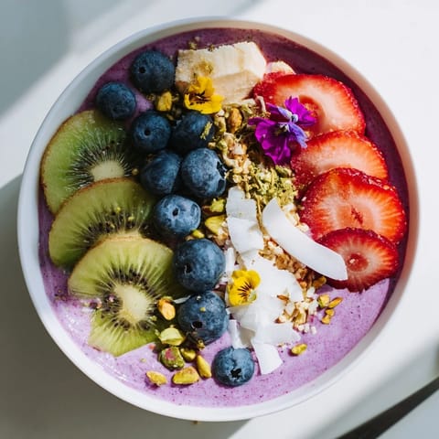 Delightfully creamy Vibrant Smoothie Bowls, featuring purple yam and crunchy pistachios.  