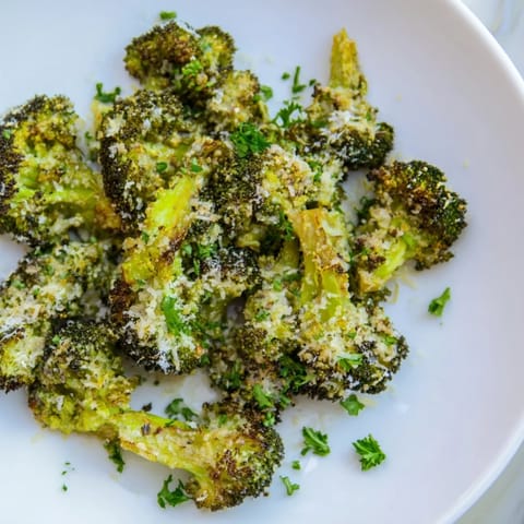 Warm, roasted Garlic Parmesan Broccoli, with melted cheese coating each tender floret.