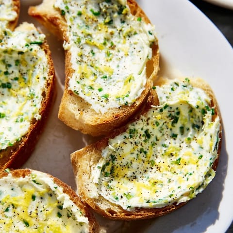 Buttery vodka-infused crostini arranged elegantly on a serving board, perfect for an easy contemporary appetizer or savory bite.