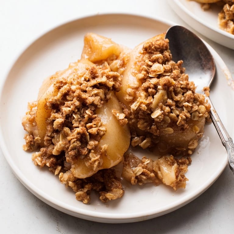 Close-up of delicious Spiced Pear Crisp with juicy pears and a crunchy oat crust.