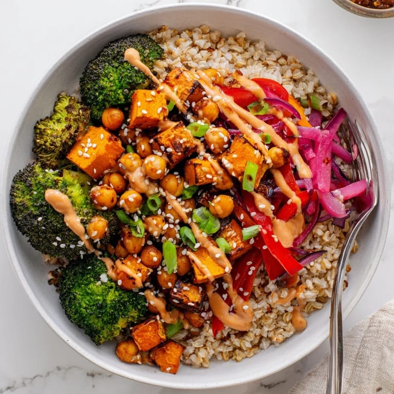 Colorful grain bowls with miso-butter drizzle and crispy chickpeas for a satisfying meal.  