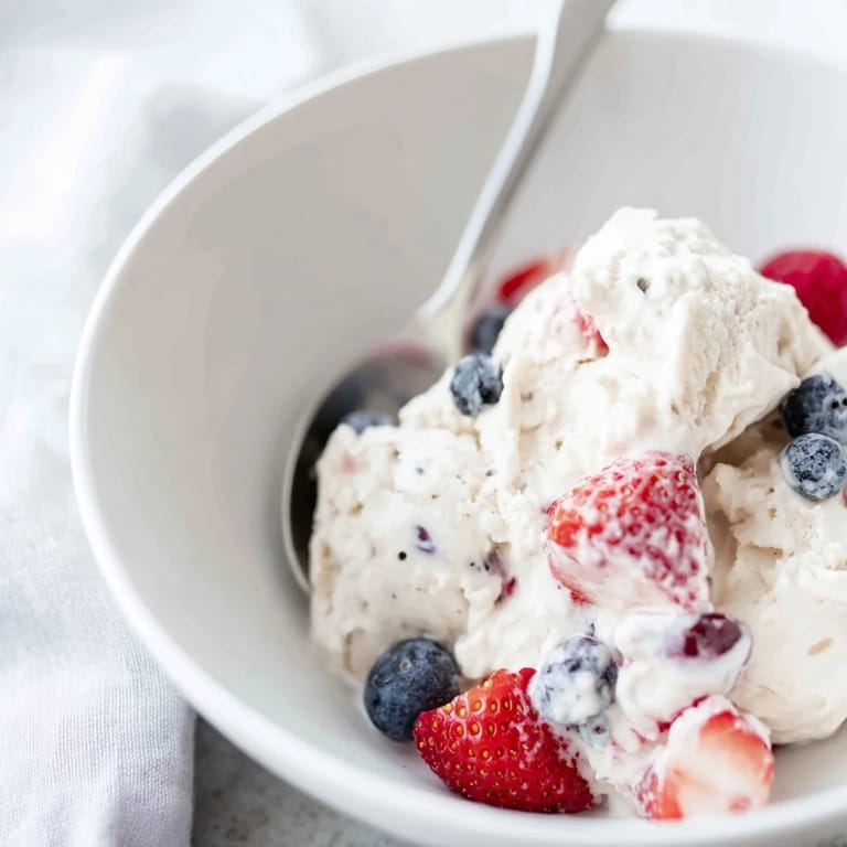 Freshly blended cottage cheese ice cream, a vibrant pink color, perfect for a summertime dessert.