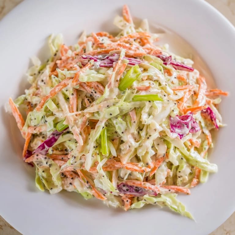 A close-up of the easy Quick Coleslaw Salad, fresh and crisp, dressed in a creamy coating.