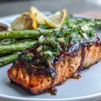 Garlic Butter Salmon with Asparagus, a tender and flaky seafood dish, roasted to perfection with crisp asparagus spears and fragrant garlic butter sauce.
